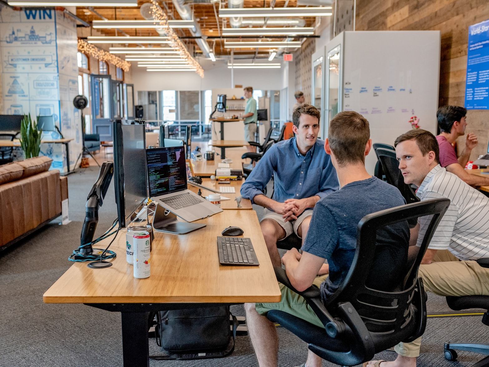 A small team working together at a shared office table